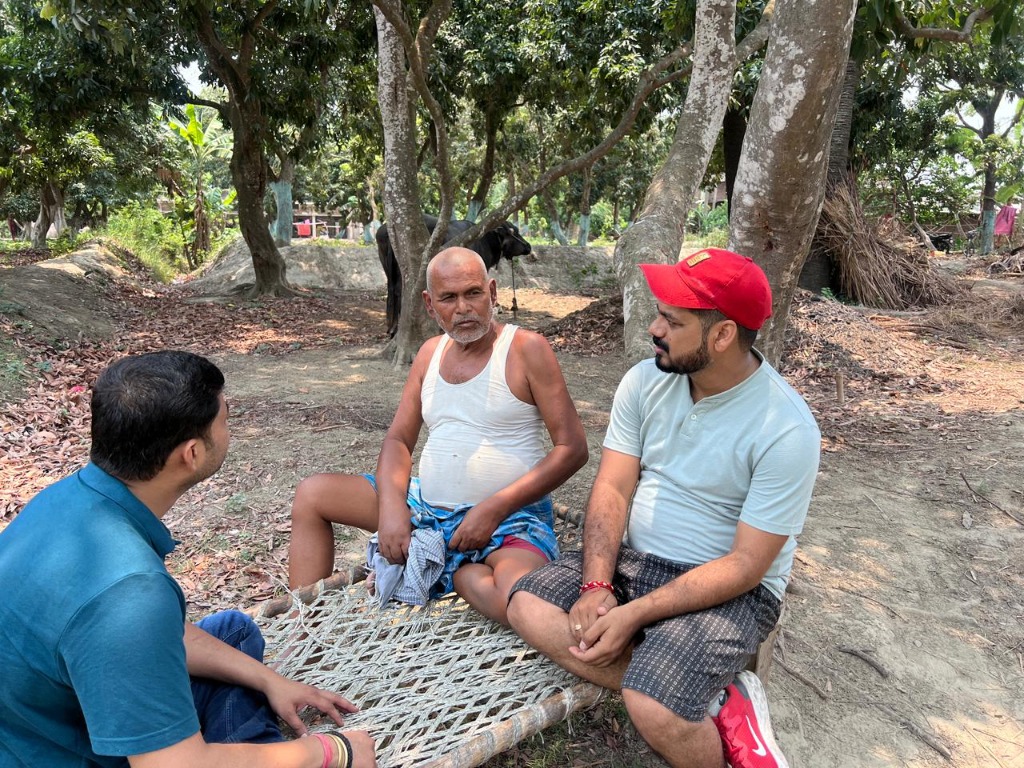 Discussing organic harvesting practices on the charpoy